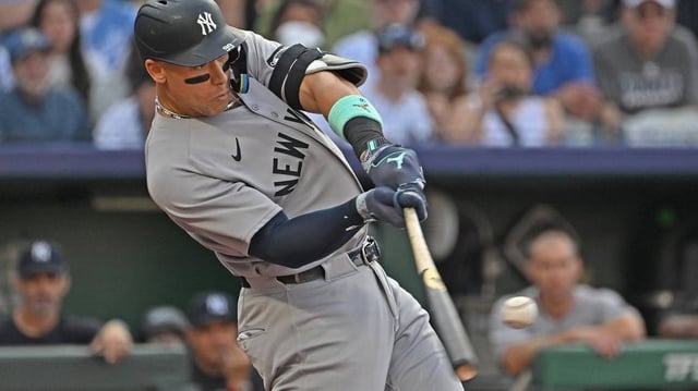 Jun 10, 2025; Kansas City, Missouri, USA;  New York Yankees designated hitter Aaron Judge (99) hits a two-run home run in the first inning against the Kansas City Royals at Kauffman Stadium. Mandatory Credit: Peter Aiken-Imagn Images