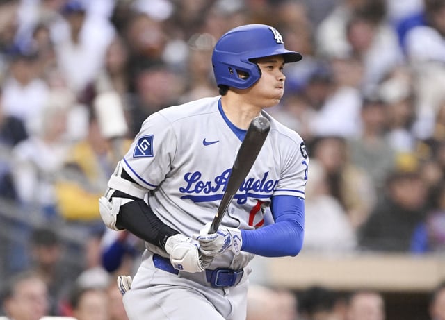 Jun 10, 2025; San Diego, California, USA; Los Angeles Dodgers designated hitter Shohei Ohtani (17) hits into a fielder’s choice during the third inning against the San Diego Padres at Petco Park. Mandatory Credit: Denis Poroy-Imagn Images