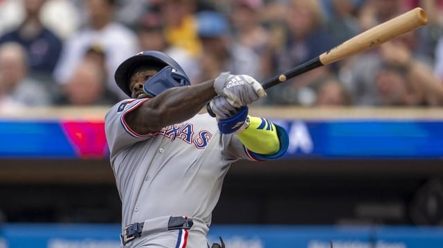 Rangers slugger Adolis Garcia rips a hit during Texas’ 16-4 onslaught of the Twins on Tuesday.