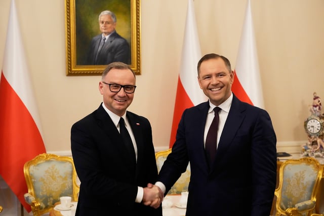 Poland's outgoing President Andrzej Duda, left, welcomes the President Elect Karol Nawrocki at the Presidential Palace in Warsaw, Poland, Tuesday, June 3, 2025. (AP Photo/Czarek Sokolowski)