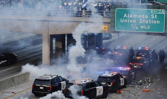 LOS ANGELES, CALIFORNIA - JUNE 08: California Highway Patrol (CHP) cars, some damaged, are lined up along the 101 freeway after officers cleared protesters from the area on June 08, 2025 in Los Angeles, California. Tensions in the city remain high after the Trump administration called in the National Guard against the wishes of city leaders following two days of clashes with police during a series of immigration raids. More protests are scheduled for today. (Photo by Mario Tama/Getty Images)