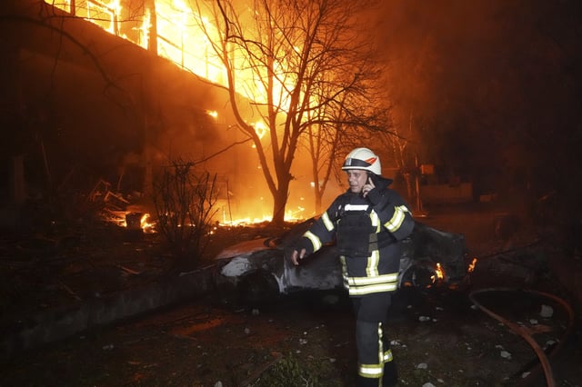 Firefighters tackle a blaze after a Russian attack that hit a residential building in Kharkiv, Ukraine, Wednesday, June 11, 2025. (AP Photo/Andrii Marienko)