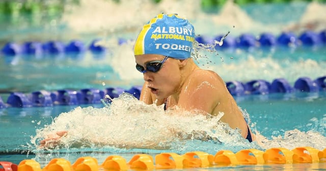 Sienna Toohey powers towards her win in the 100 metres breaststroke to qualify for the Australian team that will compete at the world championship in July. Picture by Delly Carr/Swimming Australia