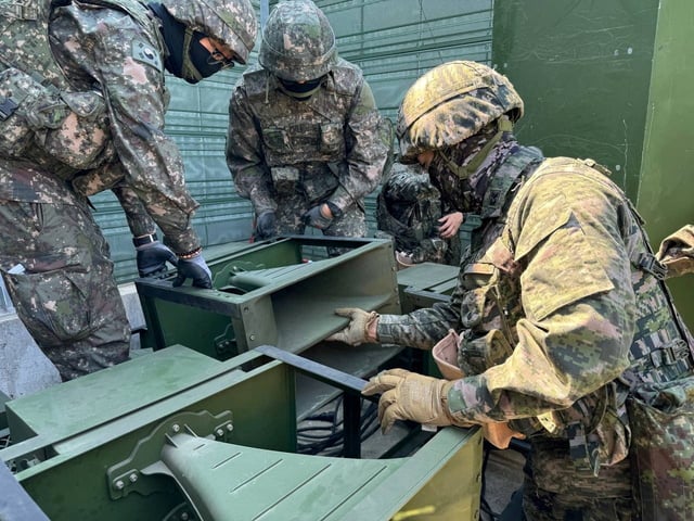 South Korean soldiers work on a loudspeaker that is set up for propaganda broadcasts during a military drill near the demilitarized zone separating the two Koreas in Paju, South Korea, in this handout picture provided by the Defense Ministry and released on June 9, 2024. The Defense Ministry/Handout via REUTERS /File Photo