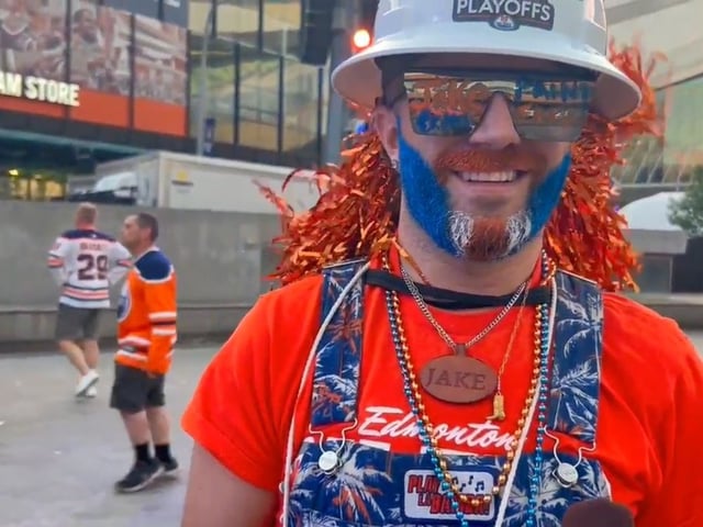 Edmonton Oilers superfan Jacob Golka, who paints fans' faces at the Moss Pit watch party outside Rogers Place in Edmonton, is seen in this image from video on Monday, June 9, 2025.