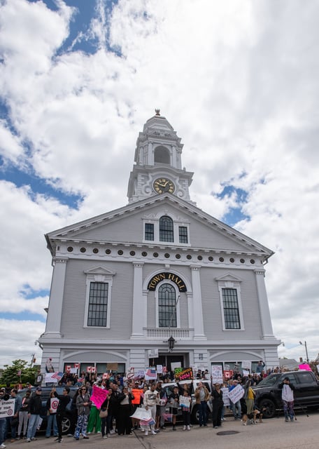 A crowd gathers during a protest in front of Milford Town Hall on Main Street, June 1, 2025. Officials from Immigration and Customs Enforcement (ICE) took Marcelo Gomes, a Milford High junior, into custody on Saturday, May 31.