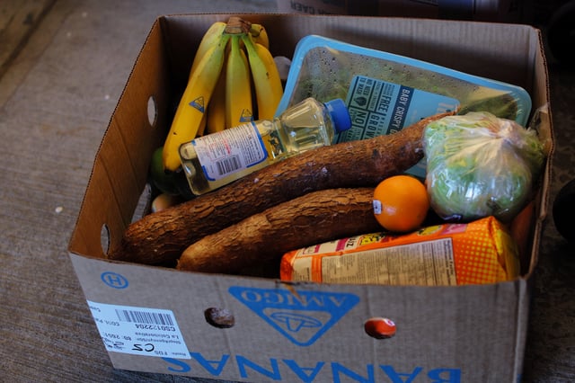 Food sits in a box of free groceries for residents at a food pantry run by La Colaborativa, as the U.S. is cutting benefits delivered through the Supplemental Nutrition Assistance Program (SNAP) by the end of March which kept millions from going hungry through the COVID-19 pandemic, in Chelsea, Massachusetts, U.S., March 8, 2023.     REUTERS/Brian Snyder/File photo