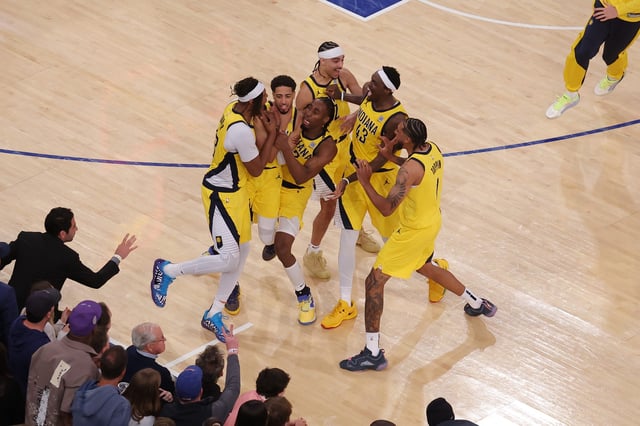 Tyrese Haliburton, second from left, celebrates with teammates after forcing overtime on a 2-point buzzer-beater in Game 1.