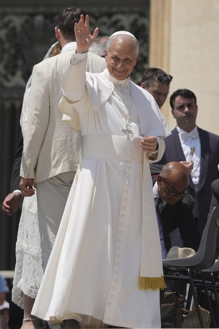 Pope Leo XIV waves at the end of his weekly general audience in St. Peter's Square at The Vatican, Wednesday, June 11, 2025. (AP Photo/Andrew Medichini)