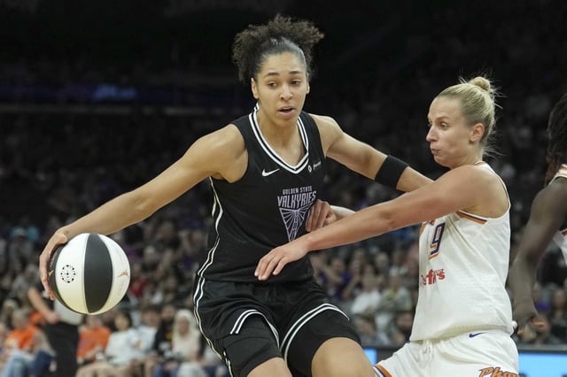 Golden State Valkyries forward Janelle Salaun, left, dribbles the ball against Phoenix Mercury guard Kitija Laksa (9) during the second half of a WNBA basketball game Thursday, June 5, 2025, in Phoenix.