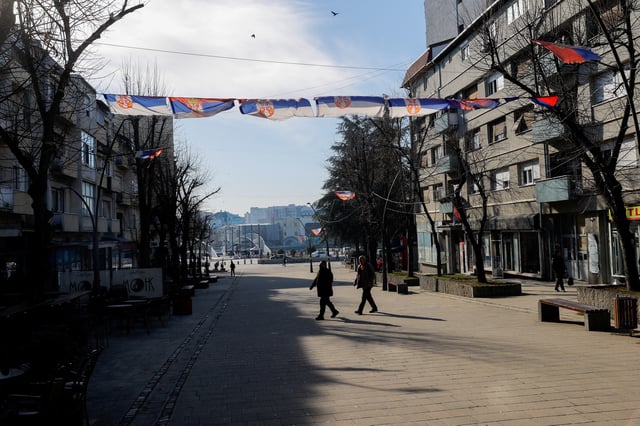 Pedestrians walk in Mitrovica, Kosovo, February 1, 2024. REUTERS/Valdrin Xhemaj/ File Photo