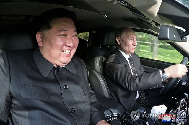 North Korean leader Kim Jong-un (L) sits next to Russian President Vladimir Putin in an Aurus Senat limousine that the latter gifted to him while driving on the grounds of the Kumsusan State Guest House in Pyongyang on June 19, 2024, in this file photo provided by the North's official Korean Central News Agency the following day. (For Use Only in the Republic of Korea. No Redistribution) (Yonhap)