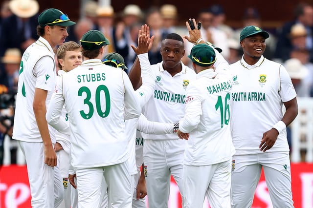 Cricket - 2025 ICC World Test Championship Final - South Africa v Australia - Lord's Cricket Ground, London, Britain - June 11, 2025 South Africa's Kagiso Rabada celebrates with teammates after taking the wicket of Australia's Cameron Green, caught out by Aiden Markram Action Images via Reuters/Andrew Boyers
