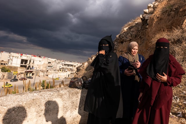 Women enjoy an afternoon in a park above the city of Homs on January 20, 2025 in Homs.