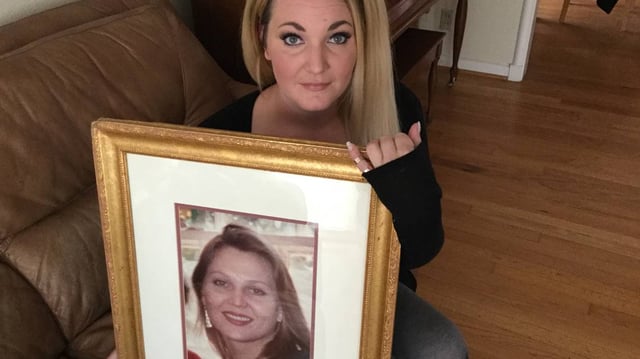 Bridget Johns holds a photograph of her half-sister, Megan Beth Johns. Bridget was only 9 when Megan was found fatally stabbed inside her Irving apartment on Oct. 5, 1994. Darryl Patrick Goggans, 61, was arrested Tuesday and charged with Johns’ murder.