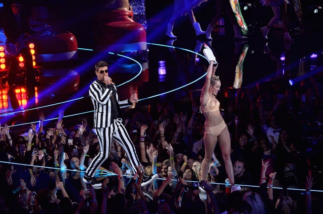 Robin Thicke and Miley Cyrus on stage at the 2013 MTV Video Music Awards.