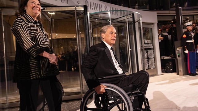 Texas Governor Greg Abbott arrives with his wife Cecilia for the ribbon cutting portion of the National Medal of Honor Museum Grand Opening Celebration in the Arlington Entertainment District on Saturday, March 22, 2025.