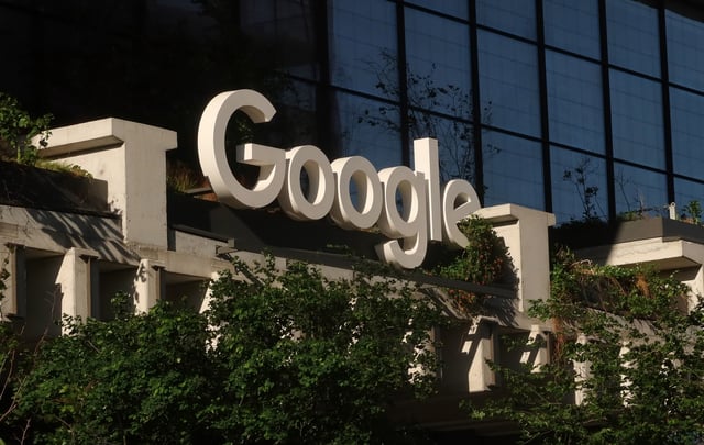 A Google corporate logo hangs above the entrance of their St. John&#39;s Terminal office on May 19, 2025, in New York City.