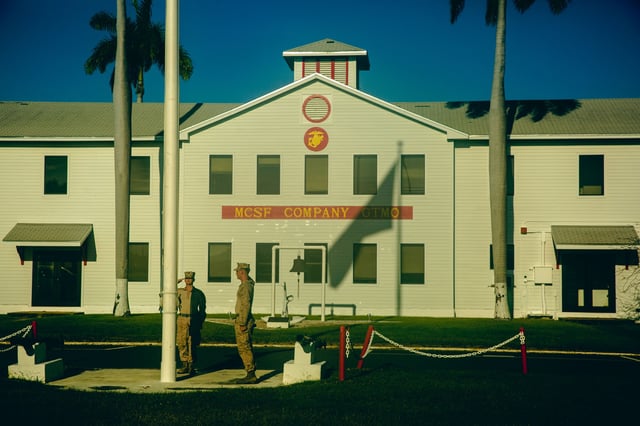 This image from June 29, 2023 shows U.S. Navy soldiers raise the flag above the Naval base during a press visit at Guantanamo Bay, Cuba.