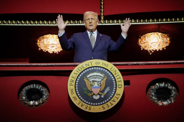 President Donald Trump gestures while he poses for a picture at the presidential box at the Kennedy Center, in Washington, D.C., U.S., March 17, 2025.