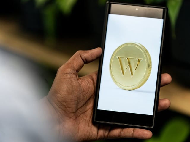 An app screenshot for Wealthsimple is seen on a smartphone in a photo illustration made in Toronto, Monday, June 17, 2024.