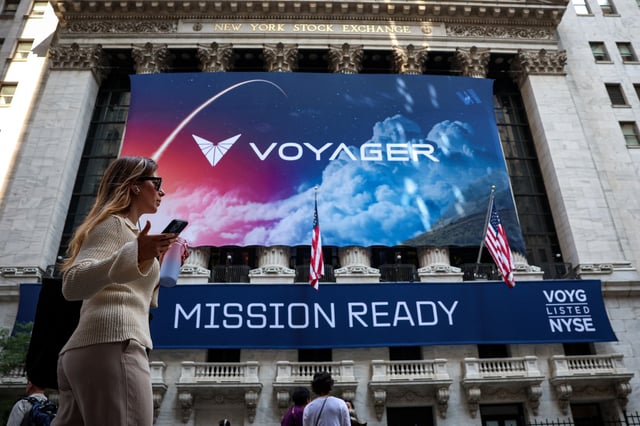A Voyager Technologies banner hangs on the front of the New York Stock Exchange (NYSE) to celebrate the company’s IPOin New York City, U.S., June 11, 2025.  REUTERS/Brendan McDermid