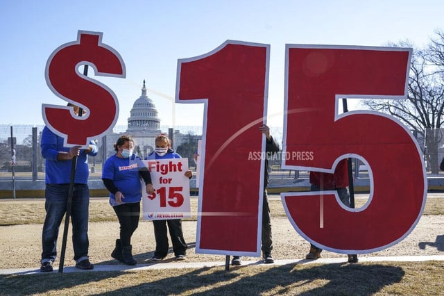 Activists appeal for a $15 minimum wage near the US Capitol in Washington in 2021. There have been many attempts to raise it, but there hasn&#39;t been an increase to federal minimum wage since 2009. (J. SCOTT APPLEWHITE/AP FILE)