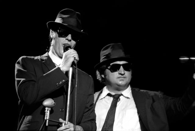 SAN FRANCISCO, CA – DECEMBER 31: Elwood Blues, portrayed by Canadian actor Dan Aykroyd, and “Joliet” Jake Blues, portrayed by American actor John Belushi (1949-1982), perform on stage during the final concert at the Winterland Arena on December 31, 1978 in San Francisco, California.  The Blues Brothers opened for the Grateful Dead. (Photo by Jeff Hochberg/Getty Images)
