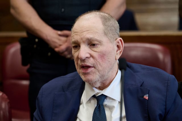 Harvey Weinstein jokes with news photographers in Manhattan criminal court as the jury in his retrial deliberates, Wednesday, June 11, 2025, in New York.
