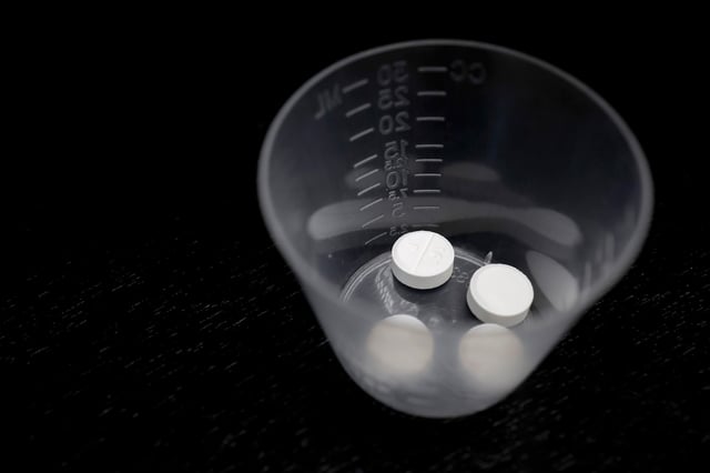 A photo illustration of Misoprostol tablets.