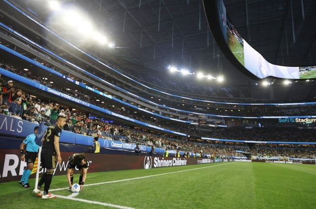 Mexico’s Cesar Huerta places the ball for a corner kick next to teammate Roberto Alvarado during the CONCACAF Nations League Final match against Panama on March 23, 2025, at SoFi Stadium. (Photo by Luiza Moraes/Getty Images)
