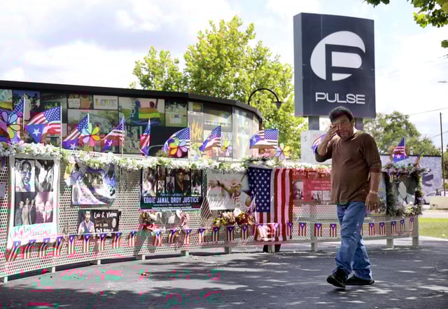 José Luís, a close friend of Pulse nightclub shooting victim Edward Sotomayor, Jr., wipes tears while visiting the site in Orlando on the eve of the mass shooting’s 9th anniversary, Wednesday, June 11, 2025. Sotomayor was one of the first victims identified after the Orlando massacre that killed 49 in 2016. (Joe Burbank/Orlando Sentinel)