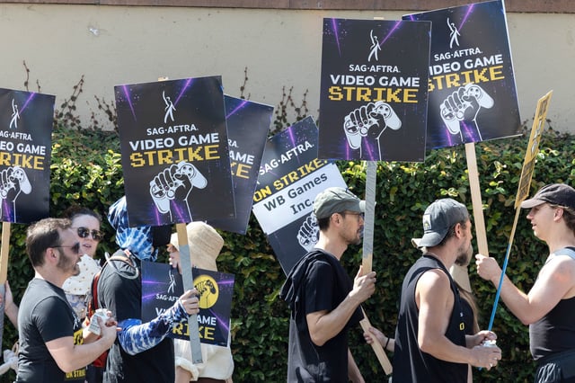 Video game actors, with many non-video game SAG-AFTRA supporters, walked the picket line at Warner Bros. Studio in Burbank on Aug. 1, 2024. 