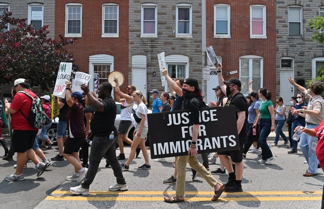 Immigrant advocacy organization CASA leads a march to denounce the targeting and detention of immigrants by ICE at retail and other locations in Baltimore City and County. (Kim Hairston/Staff)