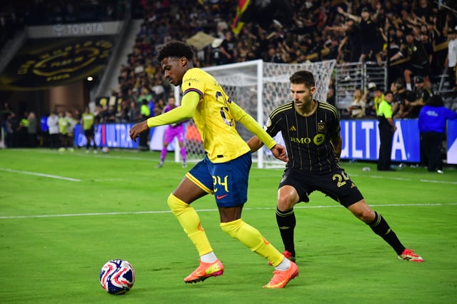 May 31, 2025; Los Angeles, California, USA; Club America midfielder Javairo Dilrosun (24) controls the ball against LAFC midfielder Ryan Hollingshead (24) in extra time during a playoff match of the 2025 FIFA Club World Cup at BMO Stadium. Mandatory Credit: Gary A. Vasquez-Imagn Images/File Photo