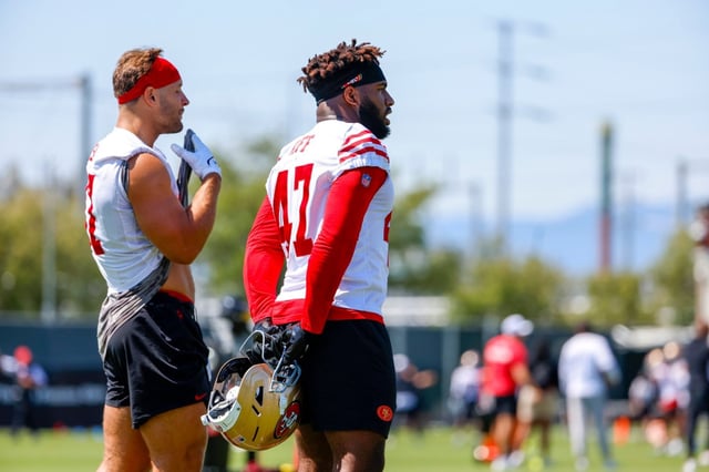 The San Francisco 49ers’ Nick Bosa (97) and San Francisco 49ers’ Bryce Huff (47) talk at the San Francisco 49ers’ practice facility in Santa Clara, Calif., on Tuesday, June 10, 2025. (Shae Hammond/Bay Area News Group)