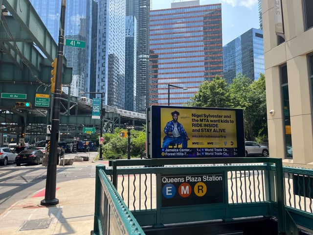 Ads from the MTA’s new campaign against subway surfing at the Queens Plaza E, M and R station. (Evan Simko-Bednarski for New York Daily News)