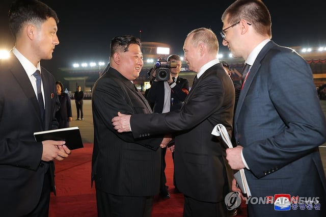 This photo, carried by North Korea's official Korean Central News Agency on June 20, 2024, shows the North's leader Kim Jong-un (2nd from L) seeing off Russian President Vladimir Putin (2nd from R) at the international airport in Pyongyang the previous day following their summit. (For Use Only in the Republic of Korea. No Redistribution) (Yonhap)