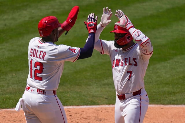 The Angels’ Jo Adell, right, is congratulated by Jorge Soler after hitting a two-run home run during the sixth inning of their game against the Athletics on Wednesday afternoon at Angel Stadium. It was Adell’s 13th of the season and his seventh in the past 11 games. (AP Photo/Mark J. Terrill)