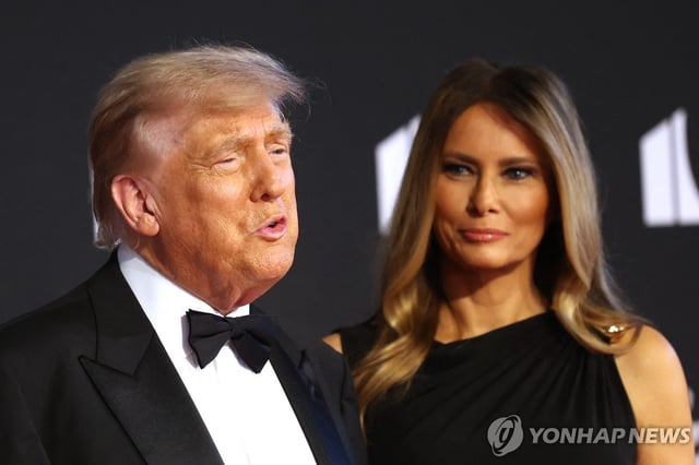 U.S. President Donald Trump (L) and first lady Melania Trump arrive to attend the opening night of "Les Miserables" at the Kennedy Center in Washington on June 11, 2025, in this photo released by AFP. (Yonhap)