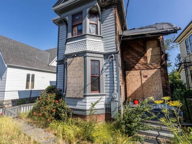 The house at Caledonia Avenue and Cook Street sustained extensive damage in the fire and remains uninhabitable, police said. DARREN STONE, TIMES COLONIST