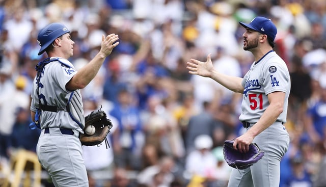 Dodgers relief pitcher Alex Vesia, right, celebrates with catcher Will Smith after the final out of their 5-2 victory over the San Diego Padres on Wednesday afternoon in San Diego. (AP Photo/Derrick Tuskan)