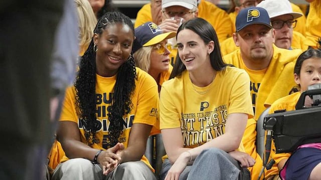 Caitlin Clark and Aliyah Boston at the 2025 NBA Finals between the Oklahoma City Thunder and the Indiana Pacers at Gainbridge Fieldhouse.