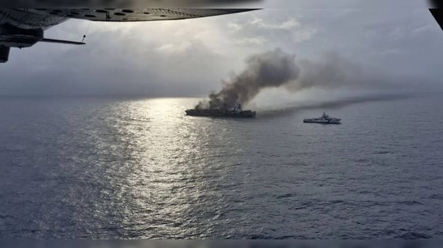 Fire continues to rage on ship