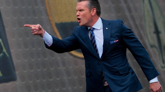 U.S. Defense Secretary Pete Hegseth takes the stage at a rally with U.S. Army troops on Tuesday, June 10, 2025, at Fort Bragg, North Carolina. (Anna Moneymaker/Getty Images/TNS)