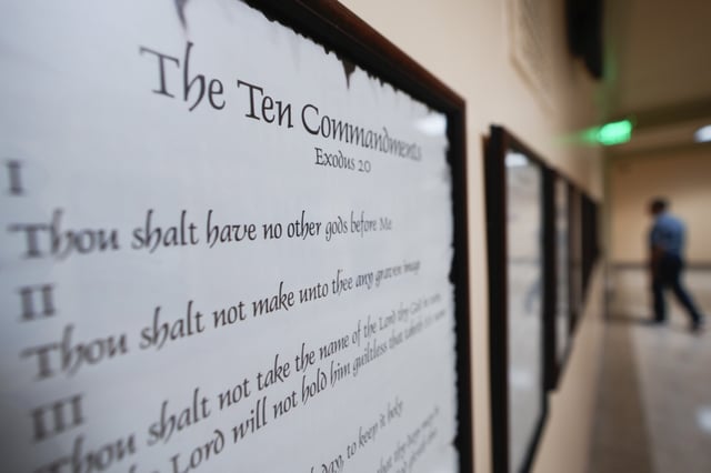 A copy of the Ten Commandments is posted along with other historical documents in a hallway of the Georgia Capitol, Thursday, June 20, 2024, in Atlanta.