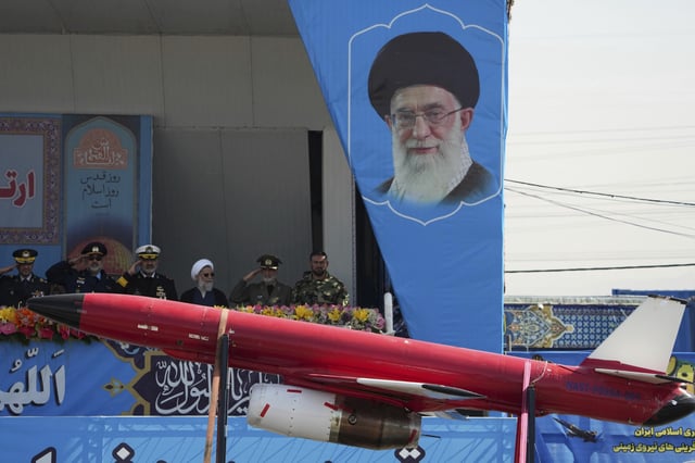 A drone is carried on a truck in front of a portrait of the Iranian Supreme Leader Ayatollah Ali Khamenei in an army parade commemorating Army Day in front of the mausoleum of the late revolutionary founder Ayatollah Khomeini just outside Tehran, Iran, Tuesday, April 18, 2023.