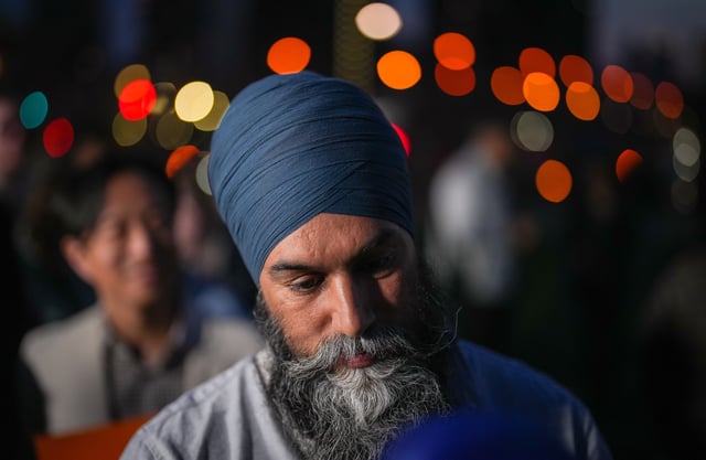 NDP Leader Jagmeet Singh listens a supporter after a campaign rally at Hubbard Park, Toronto, April 24, 2025. THE CANADIAN PRESS/Darryl Dyck
