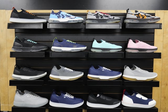 A collection of Made Plus sneakers is on display at the company's manufacturing facility in Annapolis, Md., Tuesday, June 10, 2025. (AP Photo/Stephanie Scarbrough)