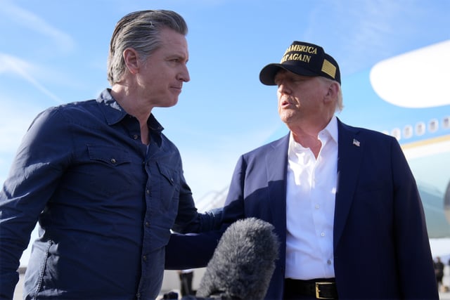 FILE - President Donald Trump talks with California Gov. Gavin Newsom after arriving on Air Force One at Los Angeles International Airport in Los Angeles, Jan. 24, 2025. (AP Photo/Mark Schiefelbein, File)